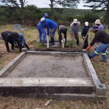4a. Busy repairing the grave