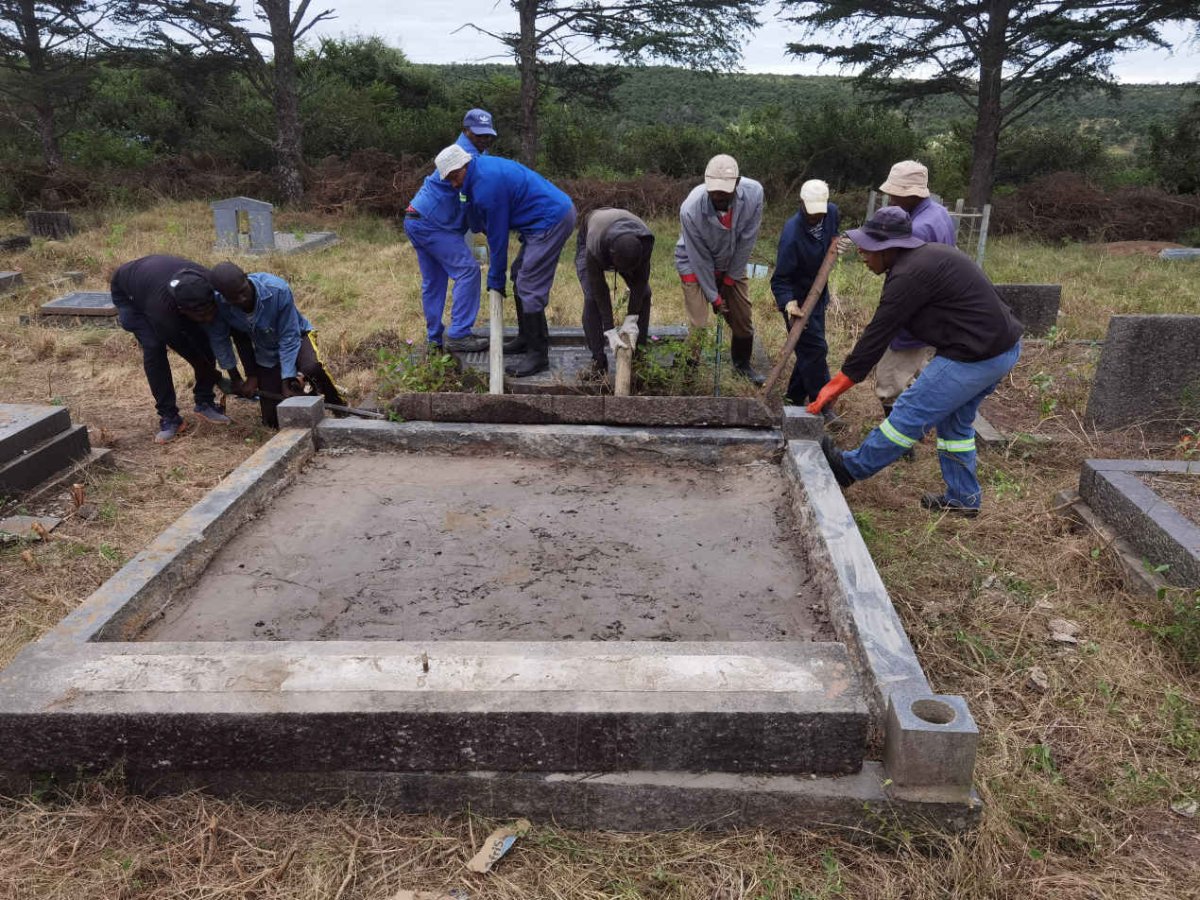 4a. Busy repairing the grave
