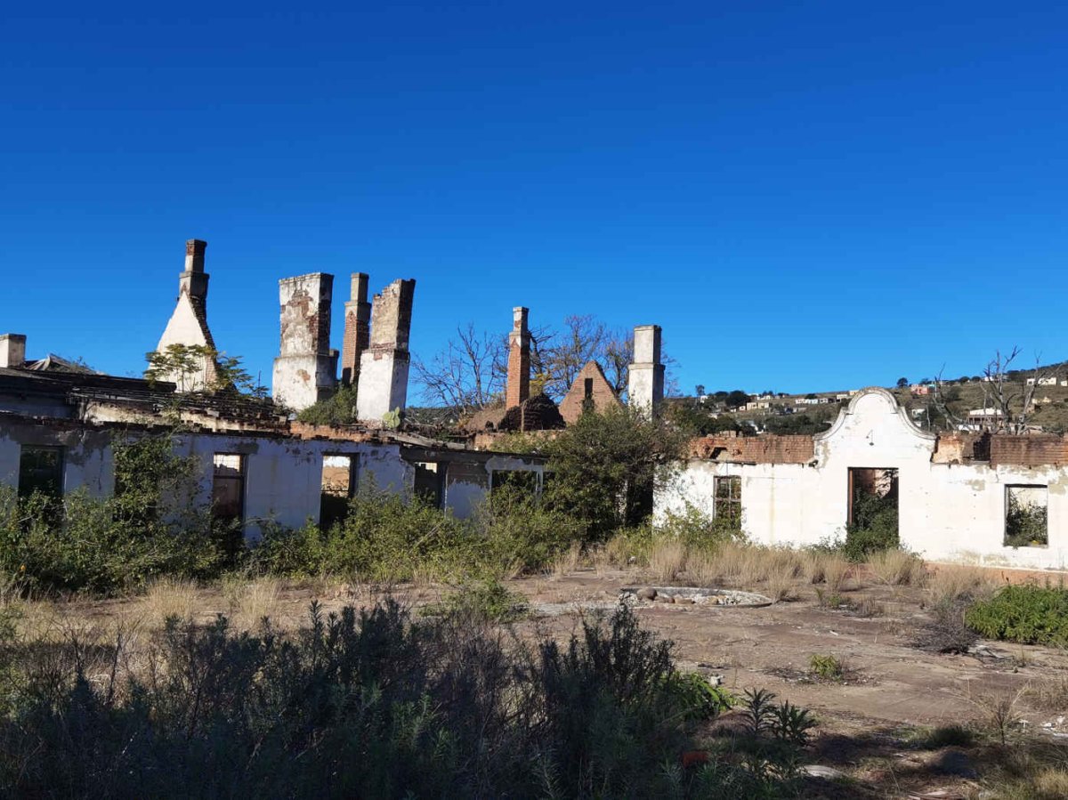 05. An unrestored section with village in background